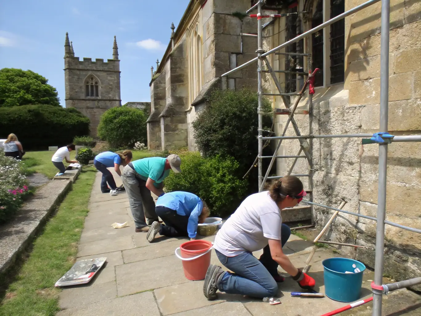 A visually appealing image featuring volunteers restoring a historical site associated with Pierre Loti, emphasizing the organization's commitment to preserving cultural landmarks and engaging the community in meaningful projects.
